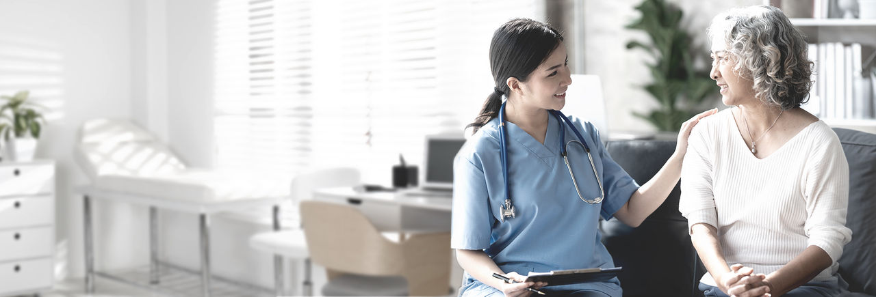 Physician discussing treatment options with middle-aged woman